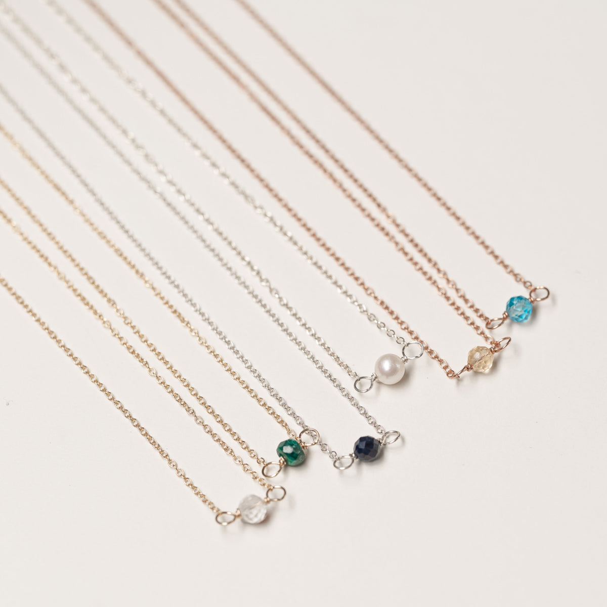 Birthstone necklaces in sterling silver, gold fill, and rose gold fill
